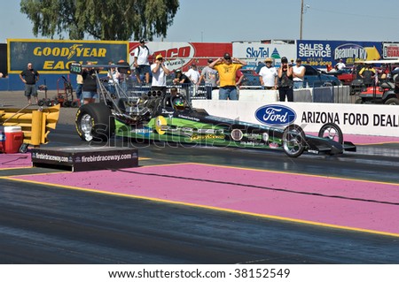 CHANDLER, AZ - OCTOBER 1: A dragster competes in the NHRA Pacific Division drag racing championship on October 1, 2009 in Chandler, Arizona.