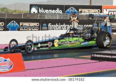 CHANDLER, AZ - OCTOBER 2: A dragster competes in the NHRA Pacific Division drag racing championship on October 2, 2009 in Chandler, Arizona.