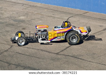 CHANDLER, AZ - OCTOBER 2: A dragster competes in the NHRA Pacific Division drag racing championship on October 2, 2009 in Chandler, Arizona.