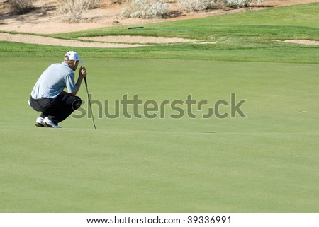 SCOTTSDALE, AZ - OCTOBER 21: George McNeill prepares to putt in the Frys.com Open PGA golf tournament on October 21, 2009 in Scottsdale, Arizona.