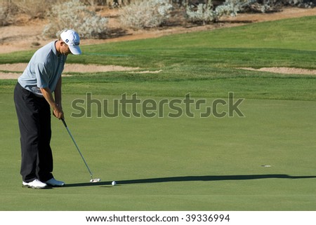 SCOTTSDALE, AZ - OCTOBER 21: George McNeill prepares putts in the Frys.com Open PGA golf tournament on October 21, 2009 in Scottsdale, Arizona.