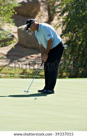 SCOTTSDALE, AZ - OCTOBER 21: Tom Lehman putts in the Frys.com Open PGA golf tournament on October 21, 2009 in Scottsdale, Arizona.