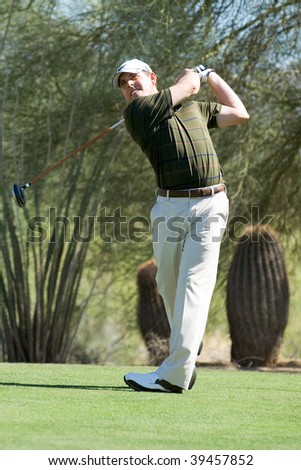 SCOTTSDALE, AZ - OCTOBER 22: Justin Leonard hits a drive in the Frys.com Open PGA golf tournament on October 22, 2009 in Scottsdale, Arizona.