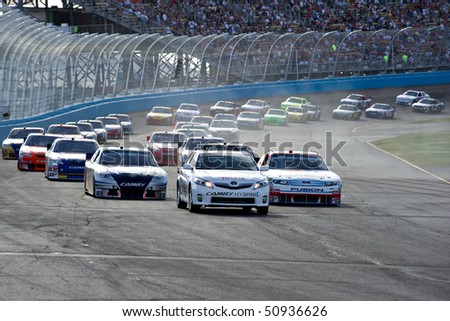 AVONDALE, AZ - APRIL 10: The pace car leads a group of cars out of turn two at the Subway Fresh Fit 600 NASCAR Sprint Cup race on April 10, 2010 in Avondale, AZ.