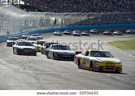 AVONDALE, AZ - APRIL 10: Clint Bowyer (#33) leads a group of cars out of turn two at the Subway Fresh Fit 600 NASCAR Sprint Cup race on April 10, 2010 in Avondale, AZ.