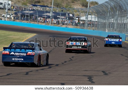 AVONDALE, AZ - APRIL 10: Scott Speed (#47) follows a group of cars into turn two at the Subway Fresh Fit 600 NASCAR Sprint Cup race on April 10, 2010 in Avondale, AZ.