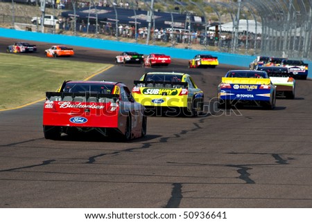 AVONDALE, AZ - APRIL 10: Kasey Kahne (#9) follows a group of cars into turn two at the Subway Fresh Fit 600 NASCAR Sprint Cup race on April 10, 2010 in Avondale, AZ.