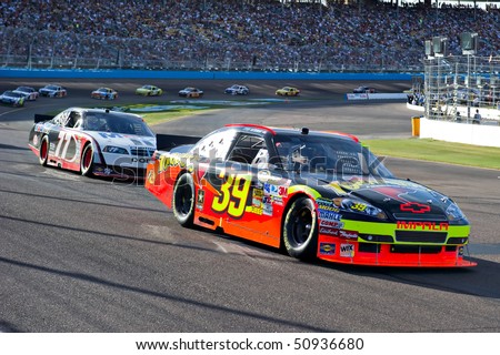 AVONDALE, AZ - APRIL 10: Race winner Ryan Newman (#39) leads a group of cars out of turn one at the Subway Fresh Fit 600 NASCAR Sprint Cup race on April 10, 2010 in Avondale, AZ.