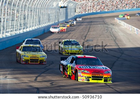 AVONDALE, AZ - APRIL 10: Jeff Gordon (#24) leads a group of cars into turn one at the Subway Fresh Fit 600 NASCAR Sprint Cup race on April 10, 2010 in Avondale, AZ.