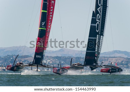 SAN FRANCISCO, CA - SEPTEMBER 12: Emirates Team New Zealand and Oracle Team USA compete in the America's Cup sailing races in San Francisco, CA on September 12, 2013