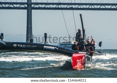 SAN FRANCISCO, CA - SEPTEMBER 12: Emirates Team New Zealand crew waves to crowd their America's Cup race in San Francisco, CA on September 12, 2013