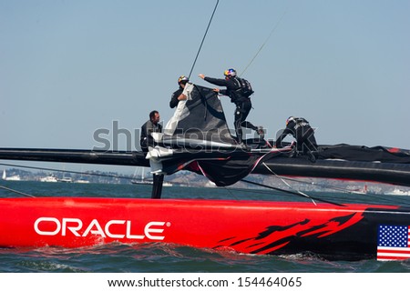 SAN FRANCISCO, CA - SEPTEMBER 12: The crew of Oracle Team USA changes sails in the America\'s Cup sailing races in San Francisco, CA on September 12, 2013
