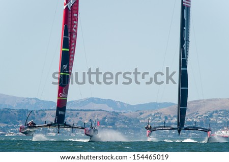 SAN FRANCISCO, CA - SEPTEMBER 12: Emirates Team New Zealand and Oracle Team USA compete in the America\'s Cup sailing races in San Francisco, CA on September 12, 2013
