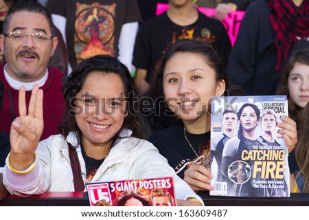 LOS ANGELES, CA - NOVEMBER 18: Fans attend the premiere of The Hunger Games: Catching Fire at the Nokia Theater in Los Angeles, CA on November 18, 2013