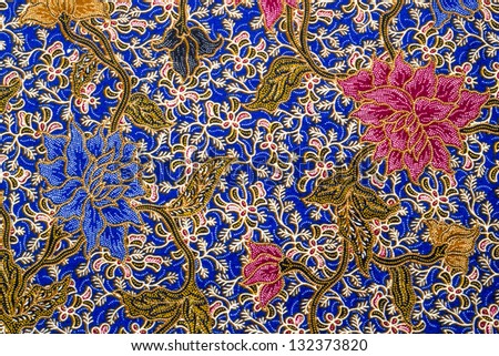 Flower and leaf batik pattern on blue bacground