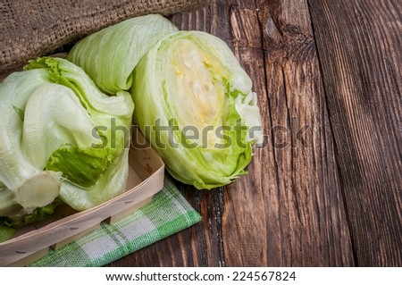 Iceberg lettuce on wooden table