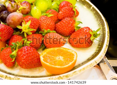 orange strawberry and grep on vintage dish