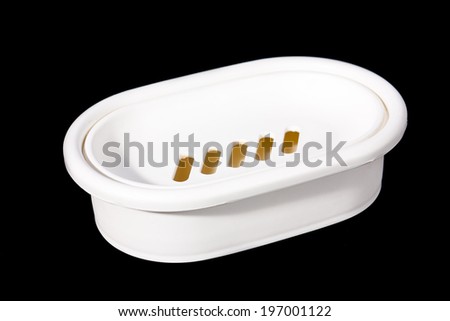 white plastic soap-box isolated on black
