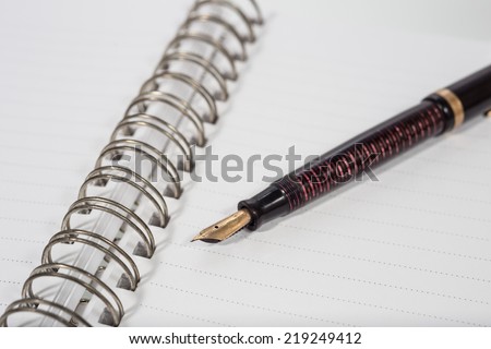 fountain pen and planner focus on a tip of pen