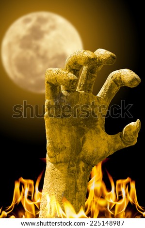 evil hand burning with full moon background