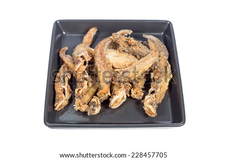 deep fried twisted-jaw catfish in plate isolated on white