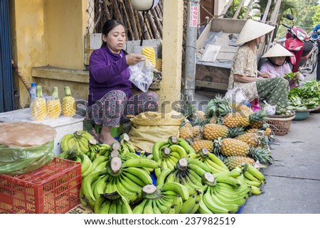 DALAT, VIETNAM - March 21  : Unidentified Vietnam woman put peeled pineapple into plastic bag on March 21 2013 at Dalat Vietnam