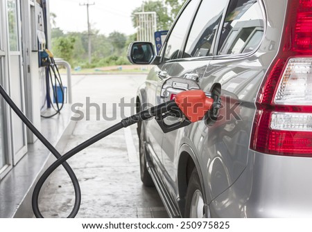 car filling the gas at the station