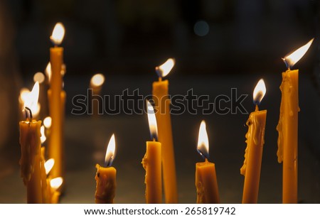 candles with flame in the dark