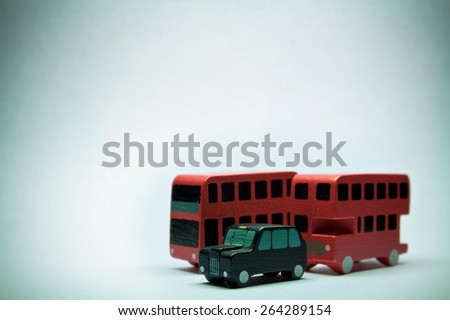 Two English buses and one cab