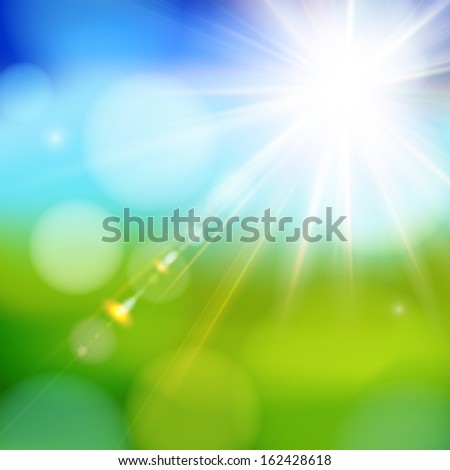 Bright shining sun with lens flare. Soft background with bokeh effect.