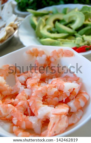 Salad ingredients - shrimps, avocados and cold cuts