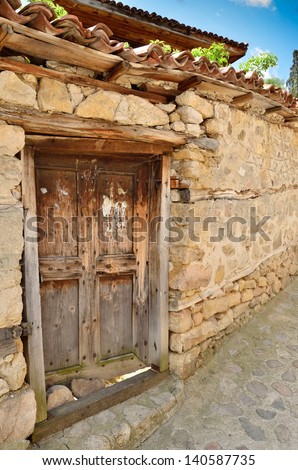 An old wooden door in Koprivshtitsa, Bulgaria, from the time of the Ottoman Empire. Koprivshtitsa is one of the hundred tourist places of the Bulgarian Tourist Union