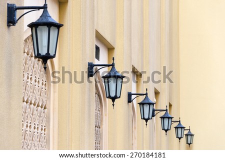 Series of lanterns on a yellow wall, Dubai, United Arab Emirates