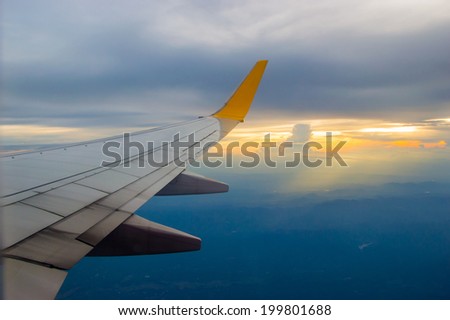 wing plane in sky sunset