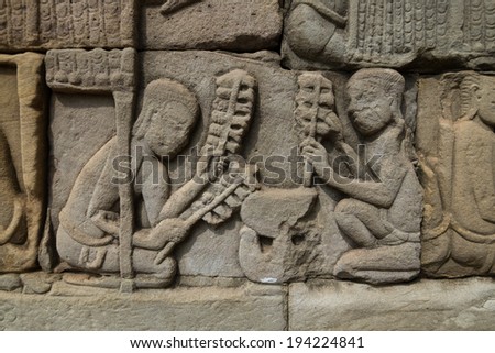 The bas relief of Cambodian culture on Bayon temple wall.