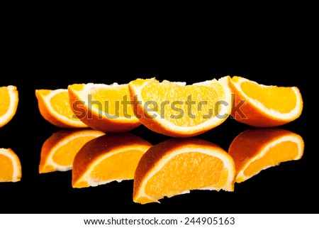 Orange fruit isolated on a black background