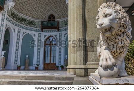 ALUPKA, UKRAINE - SEPTEMBER 2: Marble lion at the Vorontsov Palace on September 2, 2013 in Alupka. The palace is one of the most popular tourist attractions on Crimea\'s southern coast.