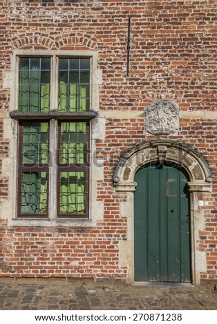 Door and window in the old quarter Begijnhof in Leuven, Belgium