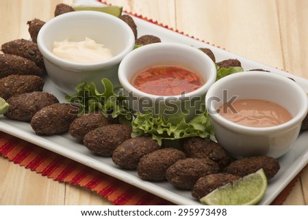 Kibbeh - Middle Eastern minced meat and bulghur wheat fried snack. Also popular party dish in Brazil (kibe)