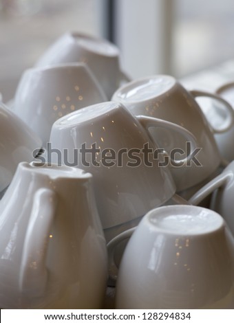 Washed white inverted coffee cups.
