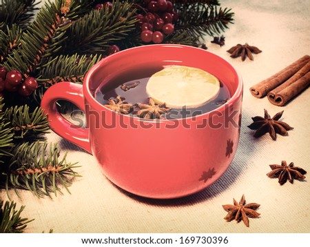 warm mulled wine poured in a red ceramic mug