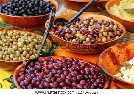 Olives of different colors in the Provence market, France / Olives in the market