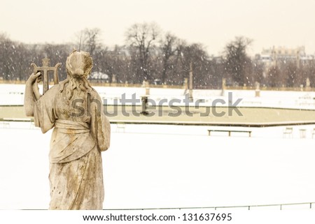 Winter in Luxembourg garden, Paris, France / back of the statue overlooking the central fountain