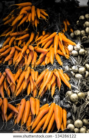 Carrots and turnips on the market for sale / color and black and white photo