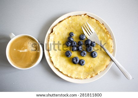 Sweet coffee break : coffee with honey pancakes and fresh blueberries.