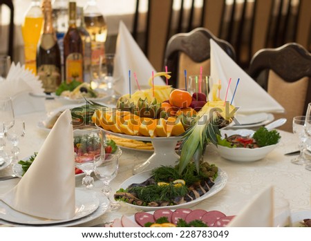 Festive banquet table with food and drinks in restaurant