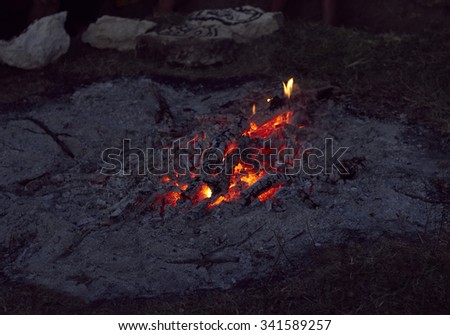 Campfire from firewood and ashes outdoors