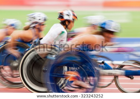 competition wheelchair in motion at the stadium