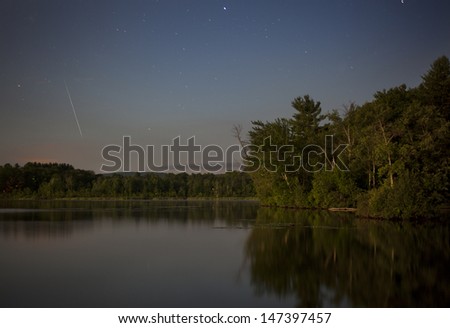 A shooting star over Onota Lake in Pittsfield, Massachusetts.