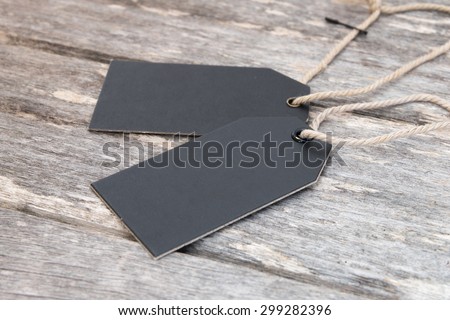 blank label tags  on wooden table